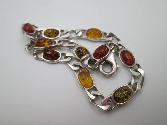 Women's articulated bracelet. Sterling silver & amber color details. 1980's