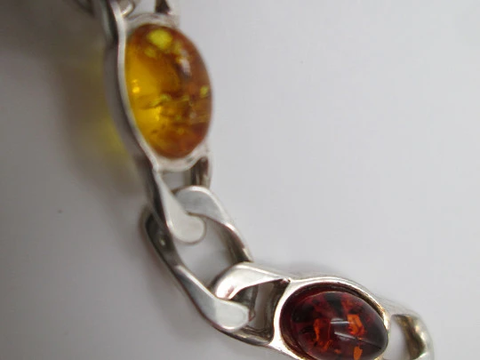 Women's articulated bracelet. Sterling silver & amber color details. 1980's