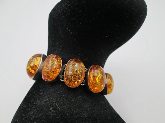 Women's articulated bracelet. Sterling silver & amber. Toggle clasp. 1980's