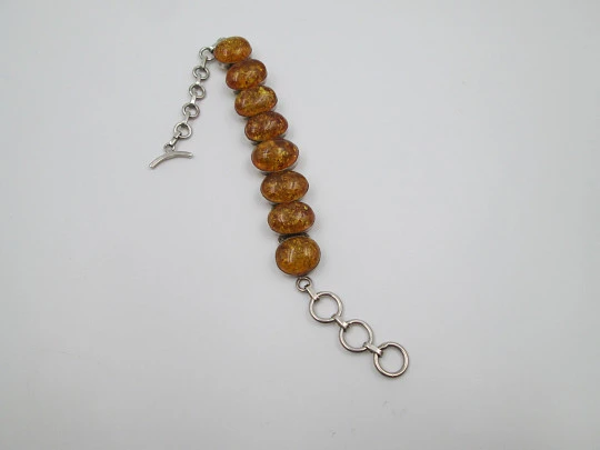 Women's articulated bracelet. Sterling silver & amber. Toggle clasp. 1980's