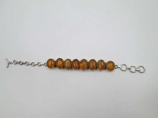 Women's articulated bracelet. Sterling silver & amber. Toggle clasp. 1980's