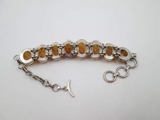 Women's articulated bracelet. Sterling silver & amber. Toggle clasp. 1980's