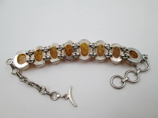 Women's articulated bracelet. Sterling silver & amber. Toggle clasp. 1980's