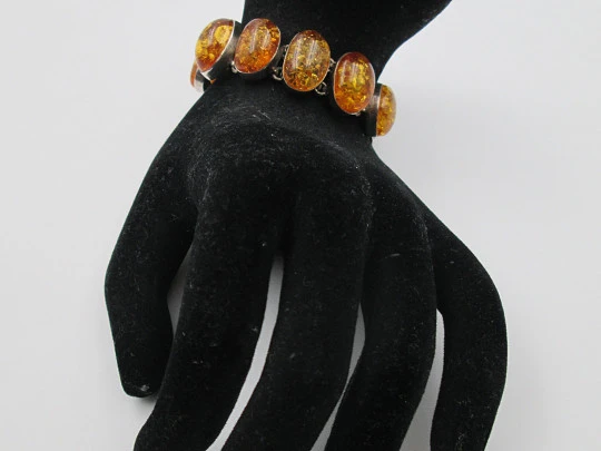 Women's articulated bracelet. Sterling silver & amber. Toggle clasp. 1980's