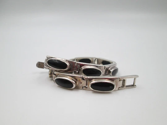 Women's articulated bracelet. Sterling silver and black stones. Tab clasp. 1990's. Europe