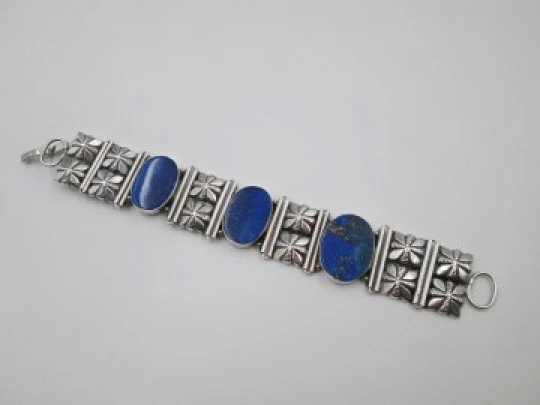 Women's articulated bracelet. Sterling silver & lapis lazuli. Floral motifs. 1980's