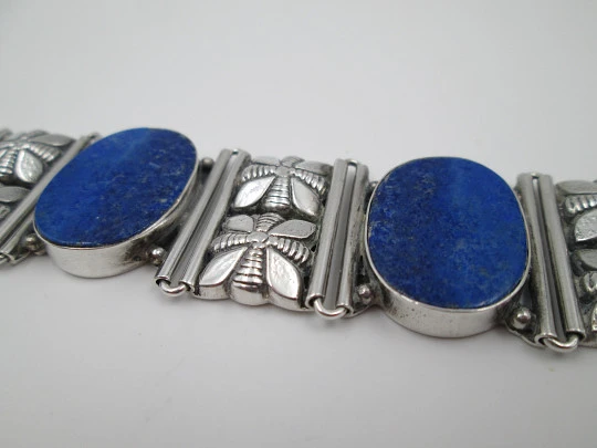 Women's articulated bracelet. Sterling silver & lapis lazuli. Floral motifs. 1980's