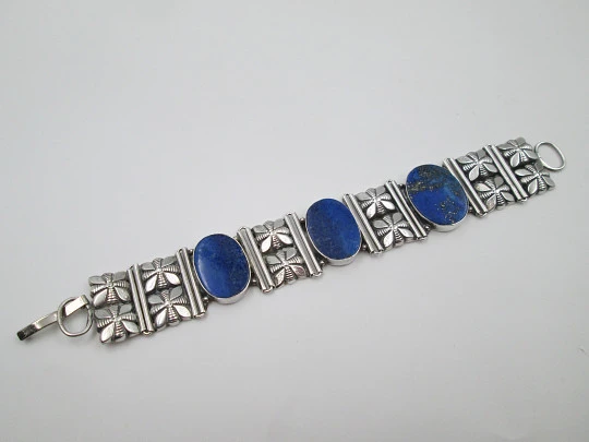 Women's articulated bracelet. Sterling silver & lapis lazuli. Floral motifs. 1980's