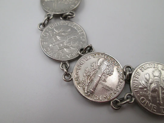 Women's articulated bracelet. US dollar cent coins. Sterling silver. Ring clasp. 1940's