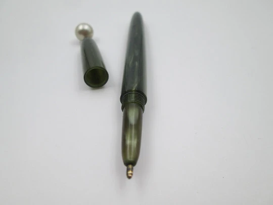 Women's ballpoint pen. Green marble plastic. Pearl ornament on top. Europe. 1950's