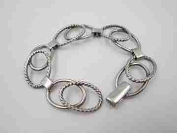 Women's bracelet. Sterling silver. Smooth and striped ovals. Tab clasp. 1970's