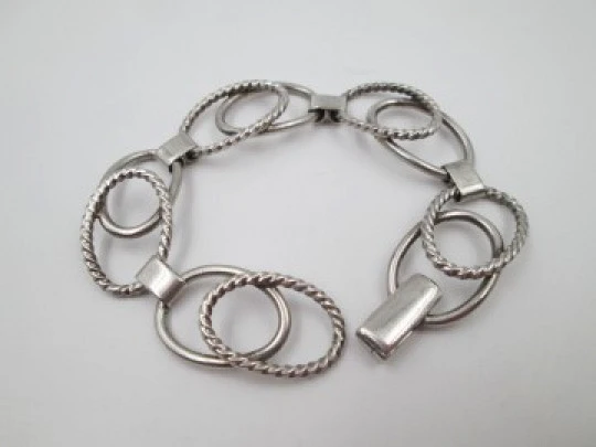 Women's bracelet. Sterling silver. Smooth and striped ovals. Tab clasp. 1970's