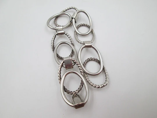 Women's bracelet. Sterling silver. Smooth and striped ovals. Tab clasp. 1970's