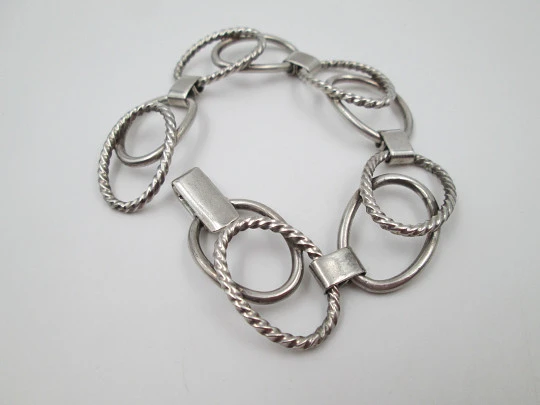 Women's bracelet. Sterling silver. Smooth and striped ovals. Tab clasp. 1970's