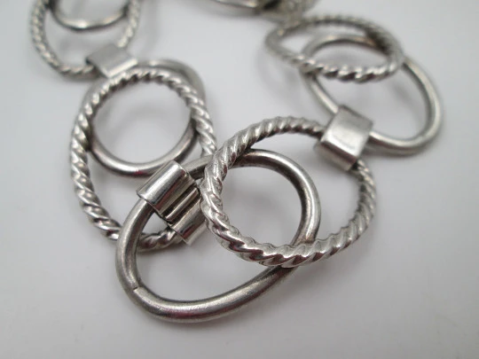 Women's bracelet. Sterling silver. Smooth and striped ovals. Tab clasp. 1970's