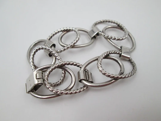 Women's bracelet. Sterling silver. Smooth and striped ovals. Tab clasp. 1970's