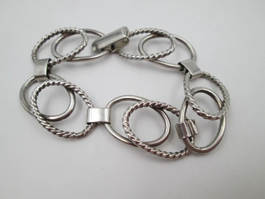 Women's bracelet. Sterling silver. Smooth and striped ovals. Tab clasp. 1970's