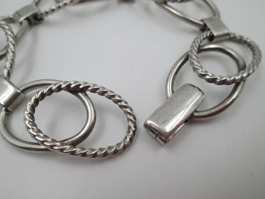 Women's bracelet. Sterling silver. Smooth and striped ovals. Tab clasp. 1970's