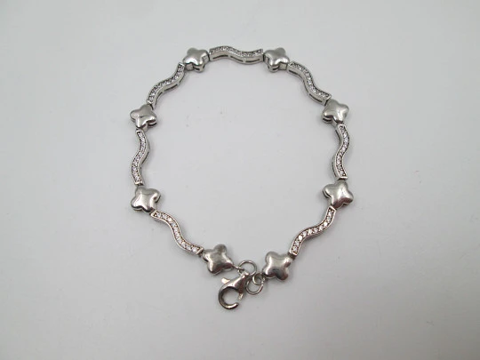 Women's bracelet. Sterling silver. Stars motifs and white stones. Ring clasp. 1990's. Europe