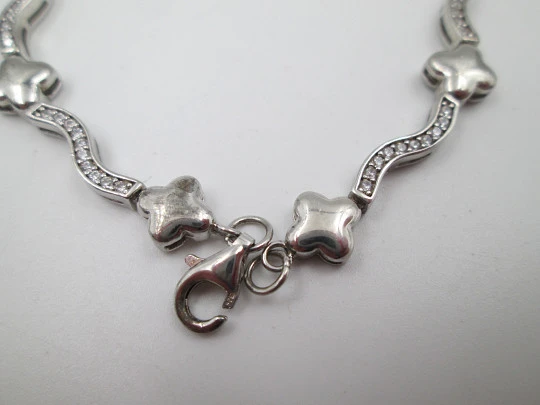 Women's bracelet. Sterling silver. Stars motifs and white stones. Ring clasp. 1990's. Europe