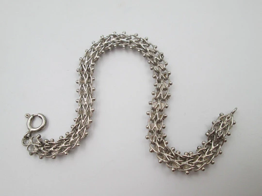 Women's braided bracelet. Sterling silver. Rhombuses and balls motifs. Europe. 1980's