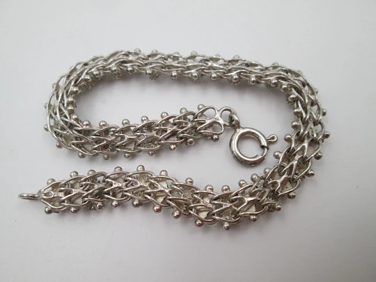 Women's braided bracelet. Sterling silver. Rhombuses and balls motifs. Europe. 1980's
