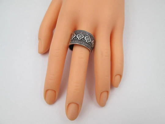 Women's broad ring. Sterling silver. Pink gems and tribal ornaments. Europe. 1990's