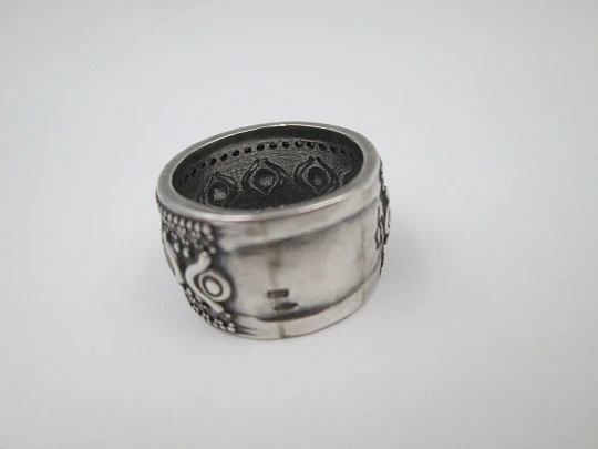 Women's broad ring. Sterling silver. Pink gems and tribal ornaments. Europe. 1990's Women's broad ring. Sterling silver. Pink gems and tribal ornaments. Europe. 1990's