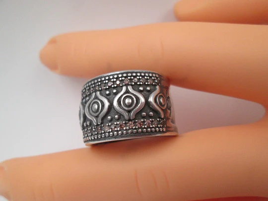 Women's broad ring. Sterling silver. Pink gems and tribal ornaments. Europe. 1990's Women's broad ring. Sterling silver. Pink gems and tribal ornaments. Europe. 1990's