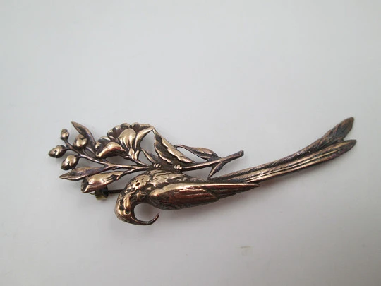 Women's brooch. Peacock on branch with flowers. Vermeil sterling silver. Europe. 1950's