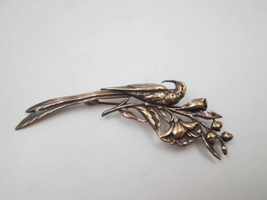 Women's brooch. Peacock on branch with flowers. Vermeil sterling silver. Europe. 1950's