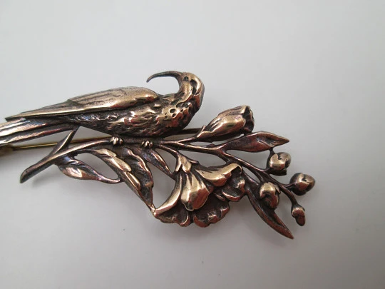 Women's brooch. Peacock on branch with flowers. Vermeil sterling silver. Europe. 1950's