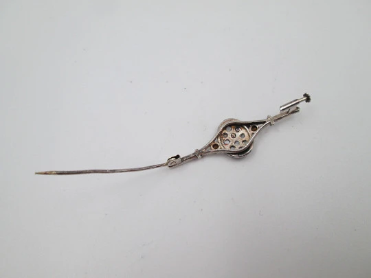 Women's brooch. Sterling silver and white gems. Oval trim. Pin on back. 1970's. Europe