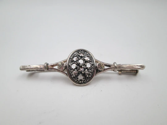 Women's brooch. Sterling silver and white gems. Oval trim. Pin on back. 1970's. Europe