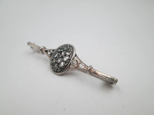 Women's brooch. Sterling silver and white gems. Oval trim. Pin on back. 1970's. Europe
