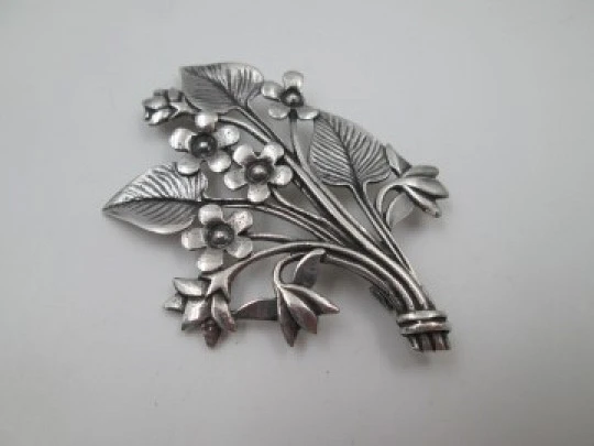Women's brooch. Sterling silver. Branch with flowers and leaves. Europe. 1960's