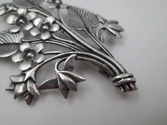 Women's brooch. Sterling silver. Branch with flowers and leaves. Europe. 1960's