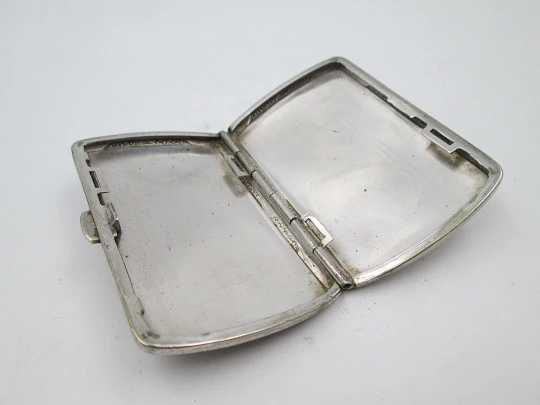 Women's cigarette case. Silver plated metal. Geometric and vegetable motifs. Europe