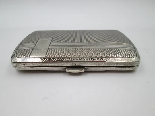 Women's cigarette case. Silver plated metal. Geometric and vegetable motifs. Europe