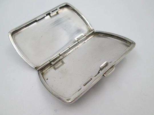 Women's cigarette case. Silver plated metal. Geometric and vegetable motifs. Europe