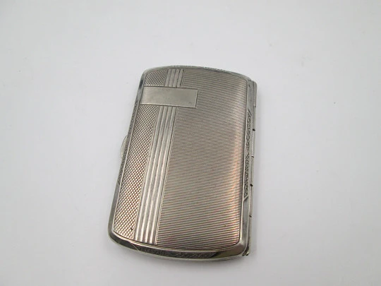 Women's cigarette case. Silver plated metal. Geometric and vegetable motifs. Europe