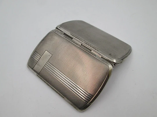 Women's cigarette case. Silver plated metal. Geometric and vegetable motifs. Europe