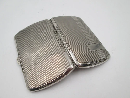 Women's cigarette case. Silver plated metal. Geometric and vegetable motifs. Europe