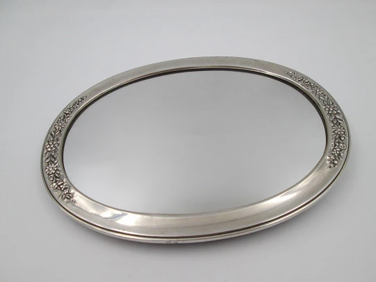 Women's dressing table mirror. Sterling silver and resin. Floral motifs. Spain. 1990's