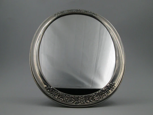 Women's dressing table mirror. Sterling silver and resin. Floral motifs. Spain. 1990's