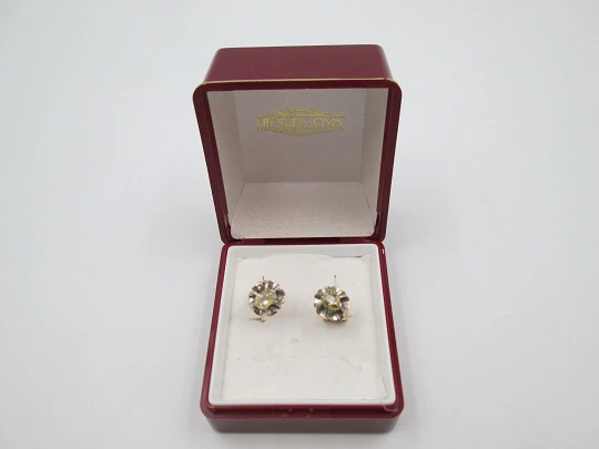 Women's earrings. 18 karat yellow gold and diamond rosettes. 1940's