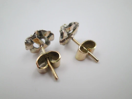 Women's earrings. 18 karat yellow gold and diamond rosettes. 1940's