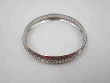Women's half round bracelet. Sterling silver. Floral engravings. 1980's