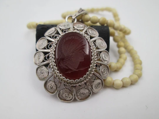 Women's ivory necklace with 900 sterling silver filigree pendant. Warrior cameo. 1940's