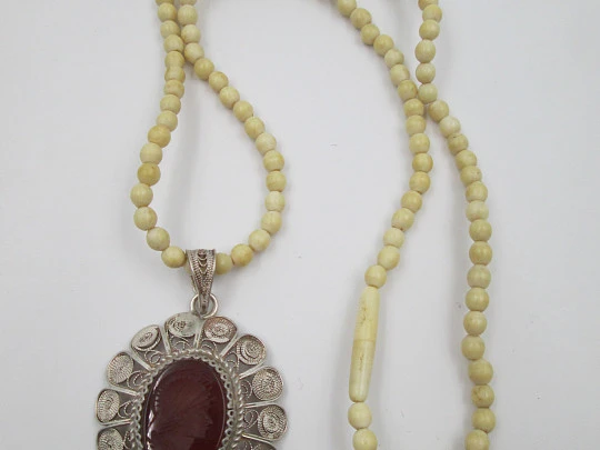 Women's ivory necklace with 900 sterling silver filigree pendant. Warrior cameo. 1940's